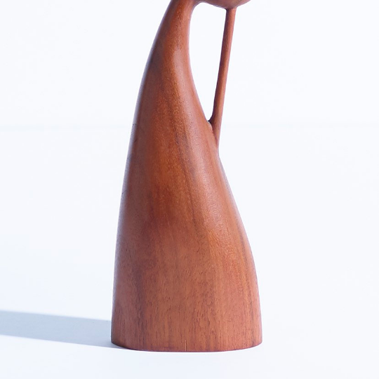 Hand carved walnut sculpture in the form of a female figure