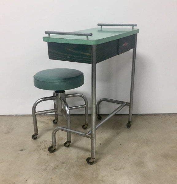 Vintage industrial tubular steel rolling stool and cantilevered table