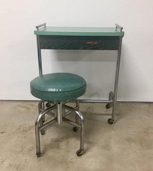 Vintage industrial tubular steel rolling stool and cantilevered table