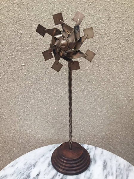 Vintage sterling pinwheel sculpture on wood base