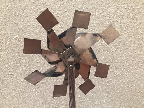 Vintage sterling pinwheel sculpture on wood base