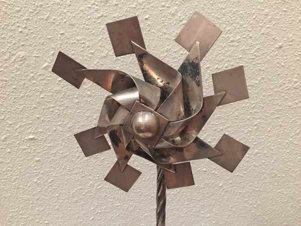 Vintage sterling pinwheel sculpture on wood base