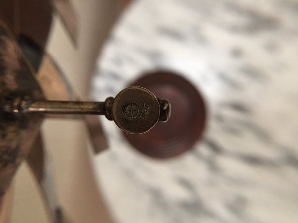 Vintage sterling pinwheel sculpture on wood base