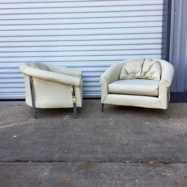 Pair of large white vinyl and chrome lounge chairs