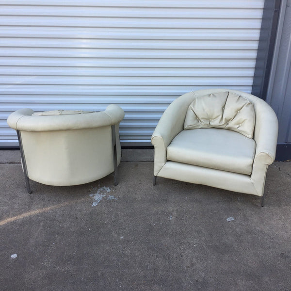 Pair of large white vinyl and chrome lounge chairs